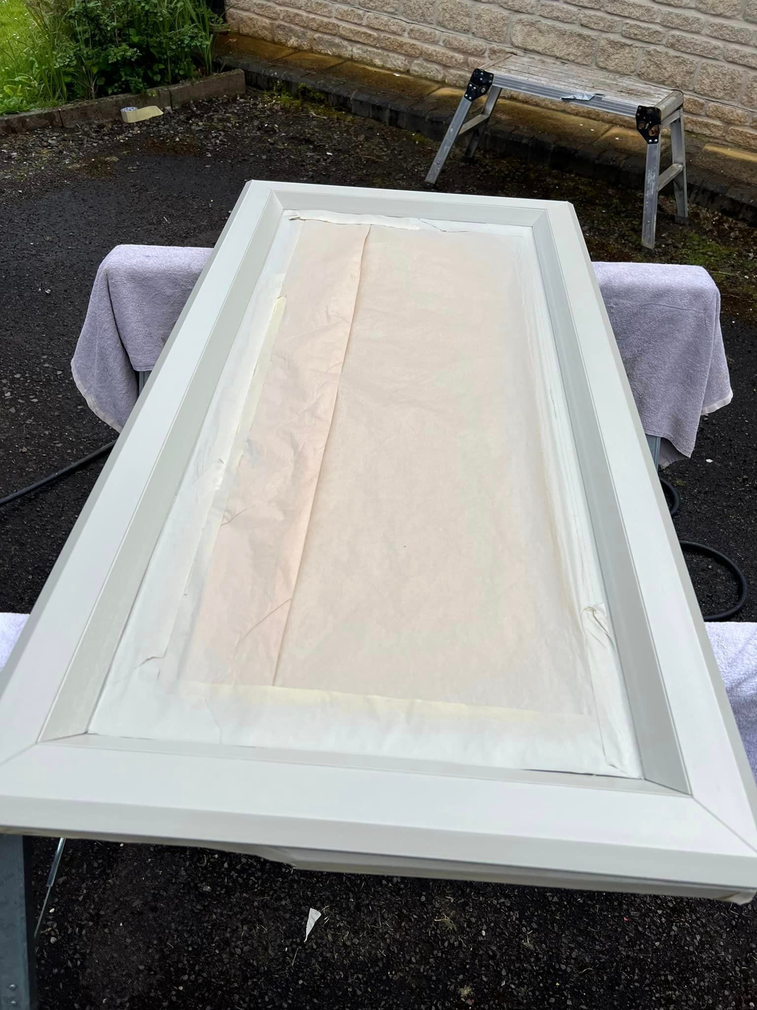 A white door is sitting on top of a table.