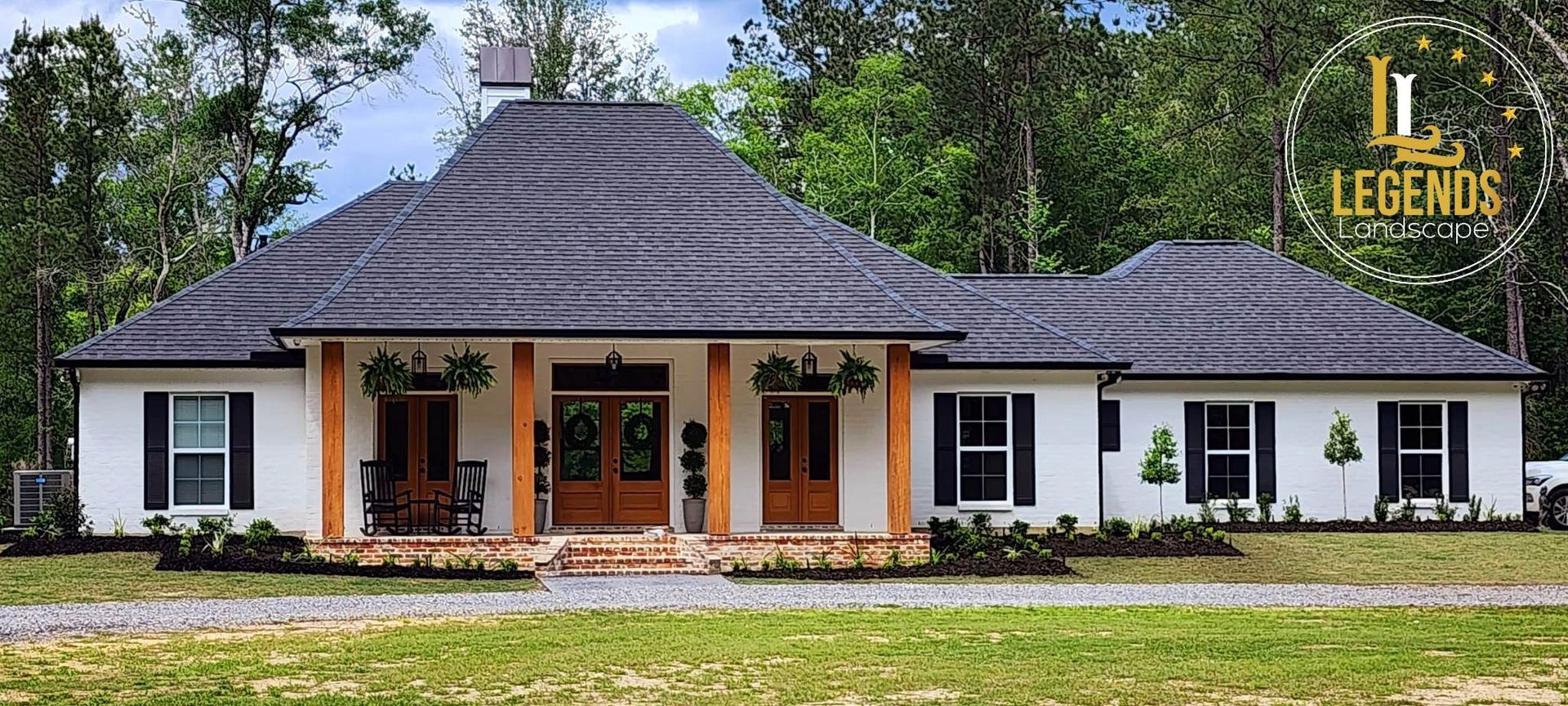 A large white house with a roof that says legends on it
