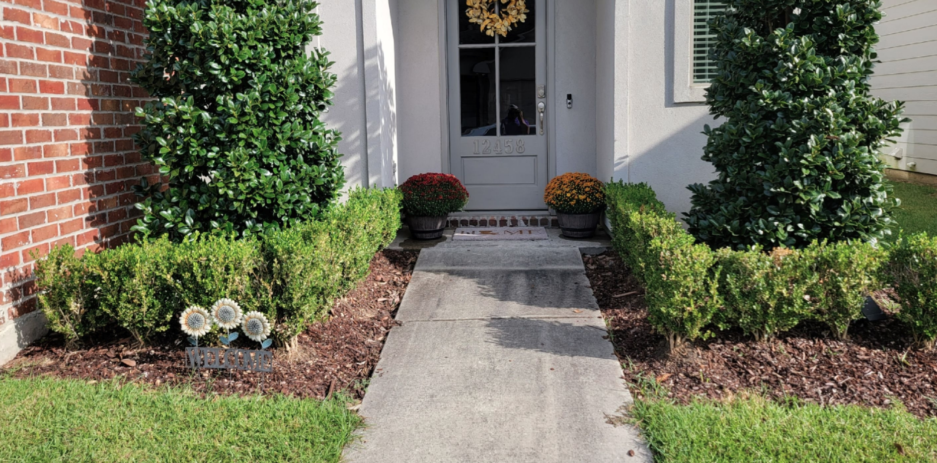 A walkway leading to the front door of a house
