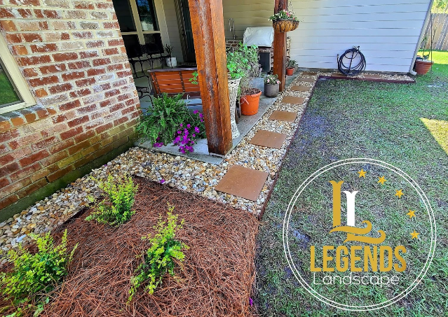 A brick house with a stone walkway leading to it.