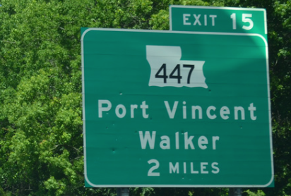 A green highway sign for port vincent walker
