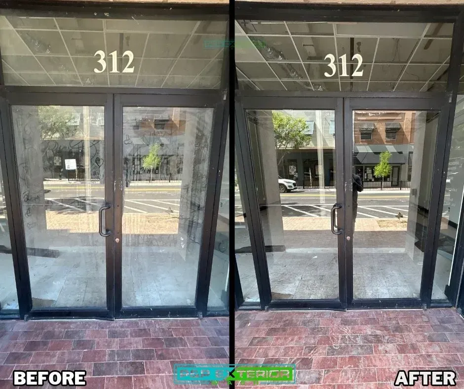 Storefront glass doors, before and after view, with reflective windows and address number 312.