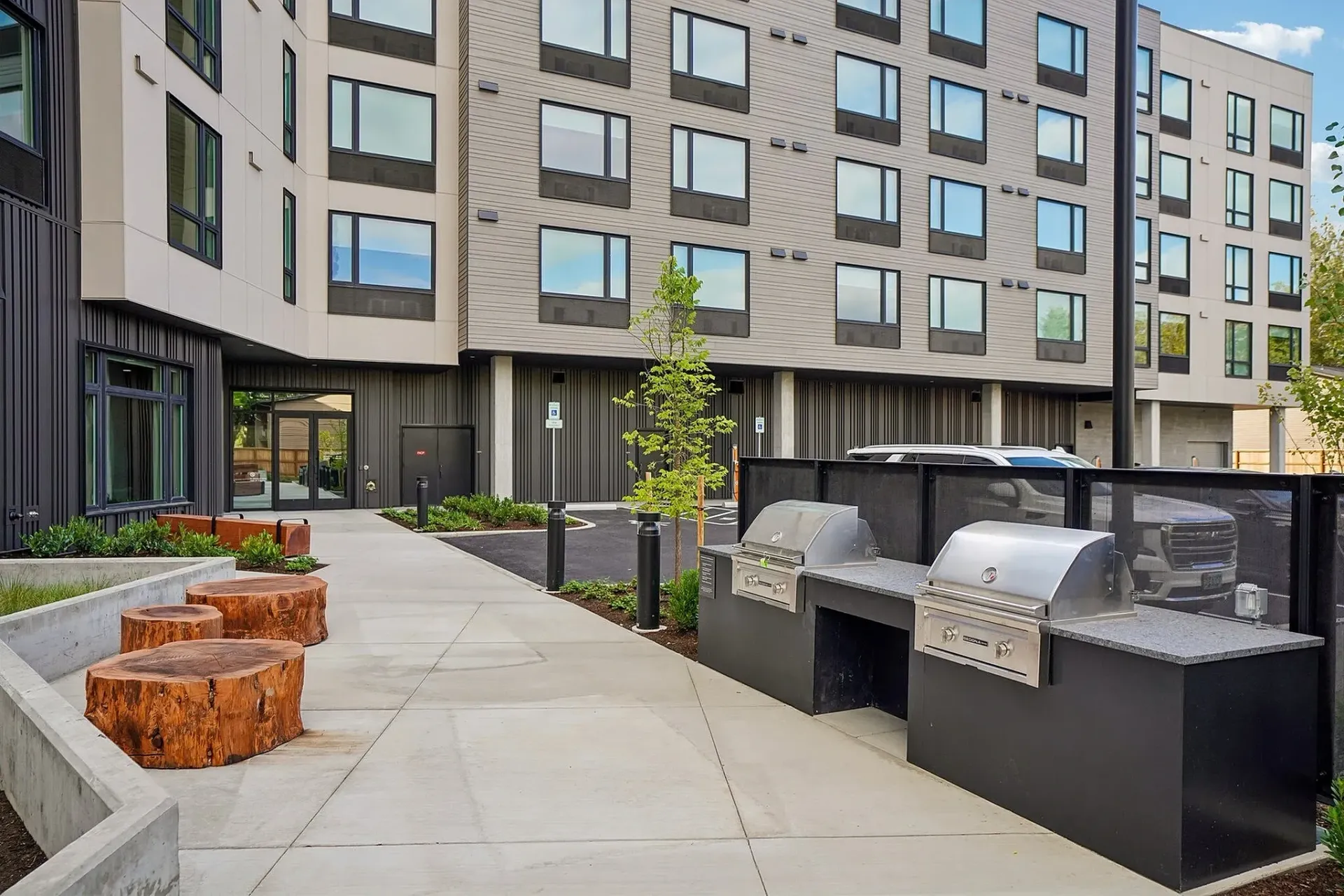 Outdoor grilling area with two built-in grills and granite countertops.