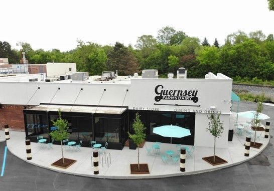An aerial view of guernsey restaurant with tables and umbrellas