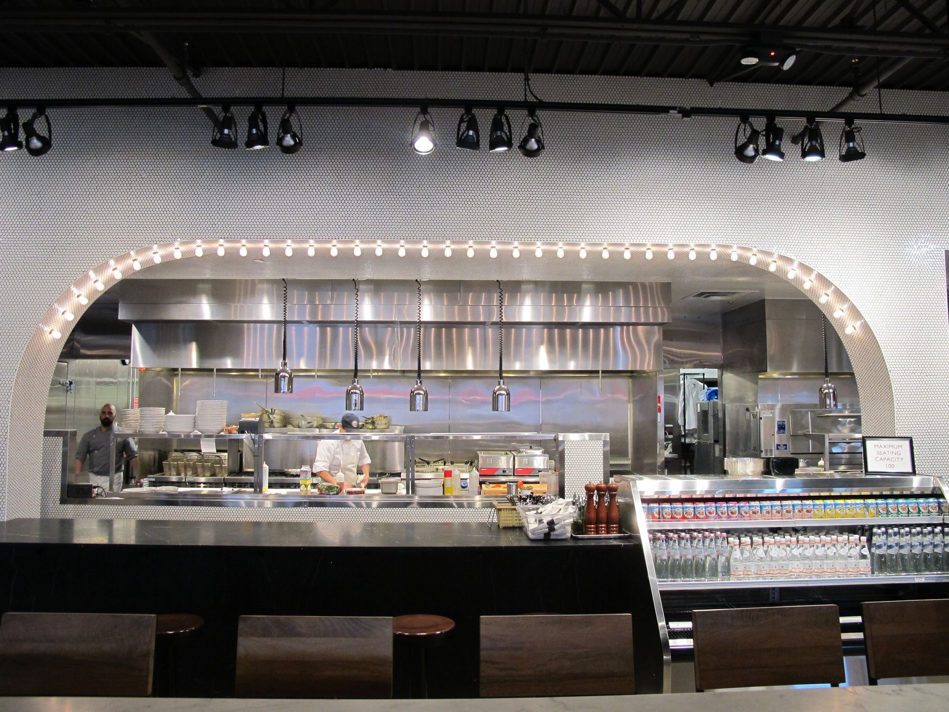 A restaurant with a brick wall and stainless steel appliances