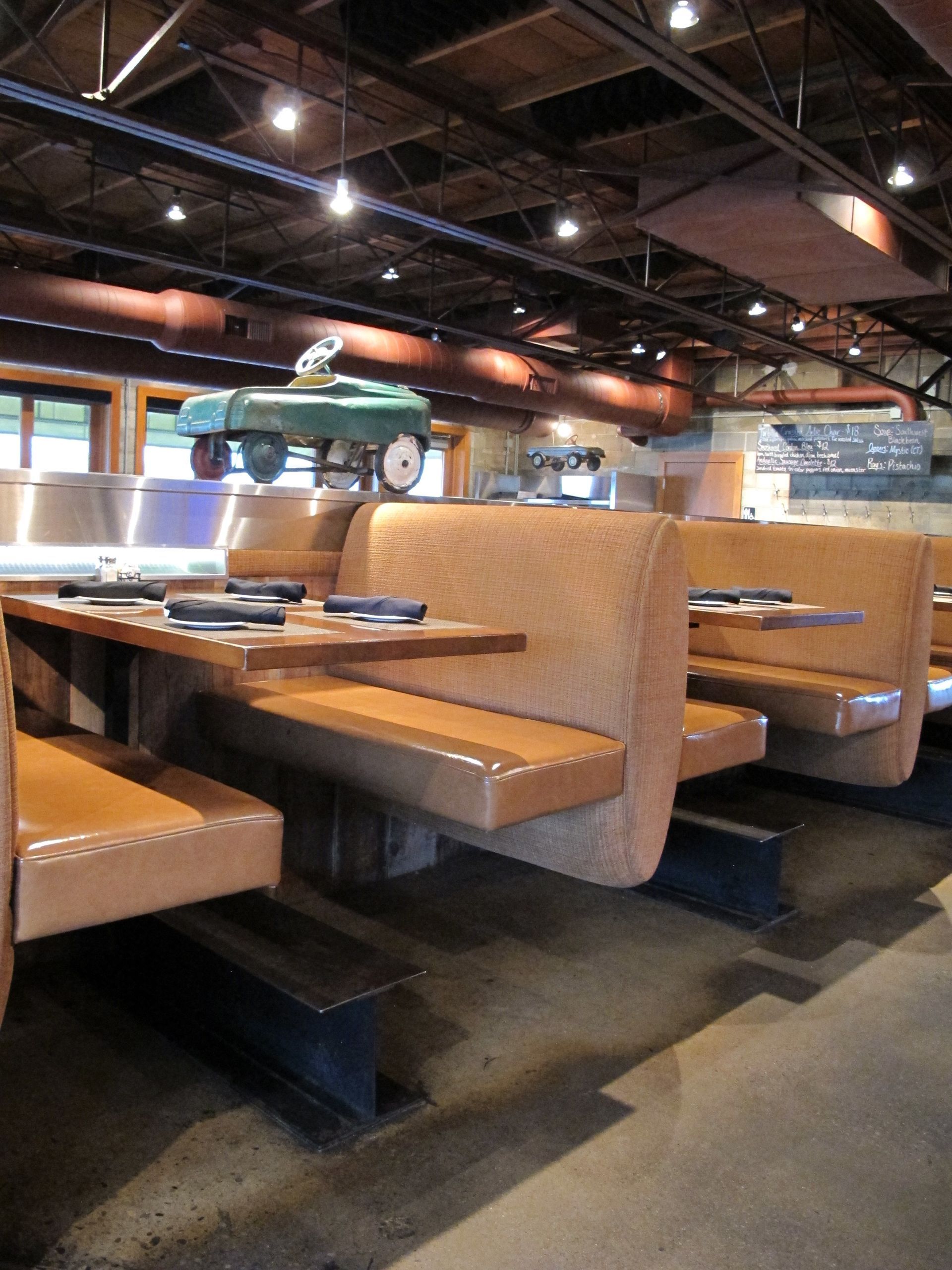 A row of booths and tables in a restaurant