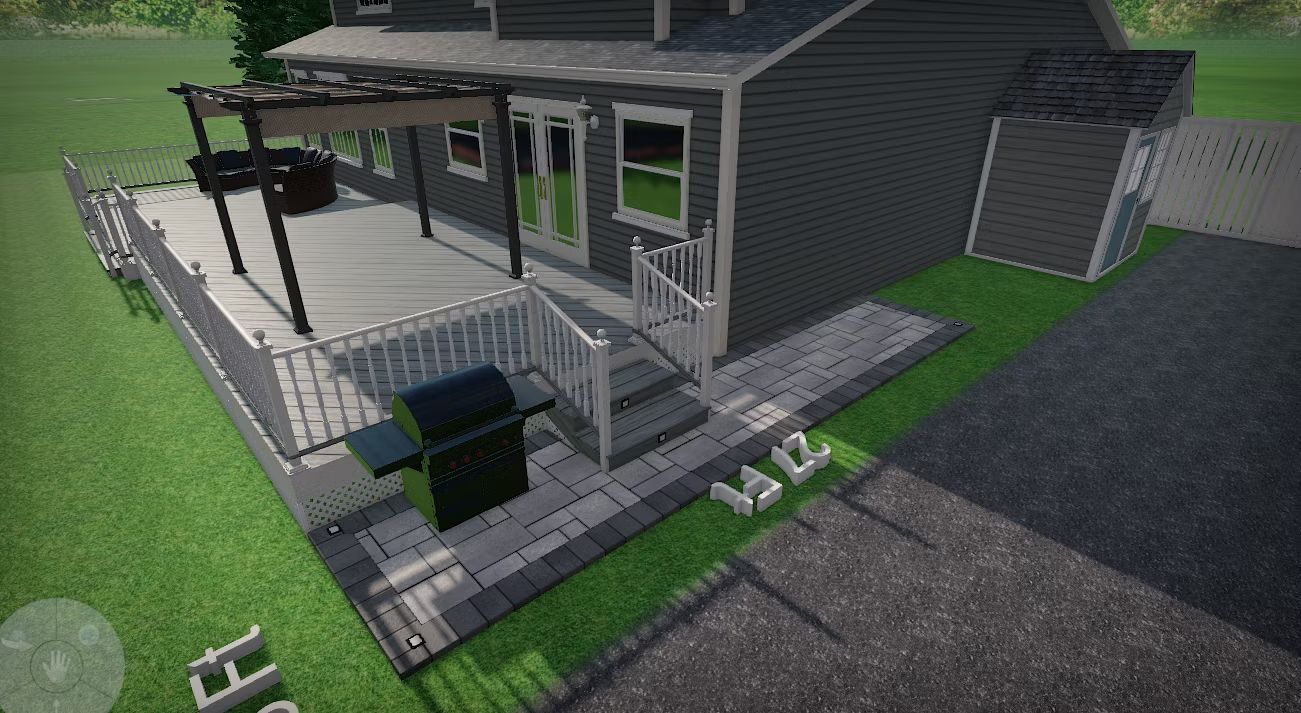 Modern dark house with a covered porch, railing, steps, and a small yard beside a driveway.
