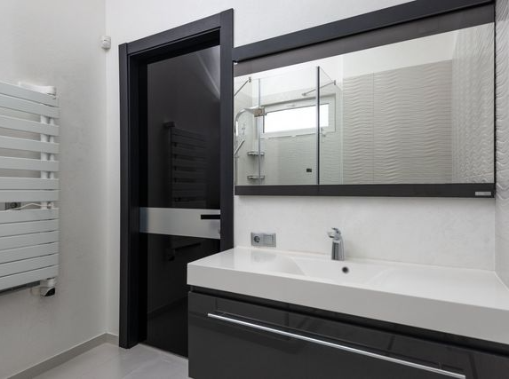 Picture of basin and heated bathroom rail as part of a bathroom renovation and bathroom design by Hackney Bathroom Fitters.
