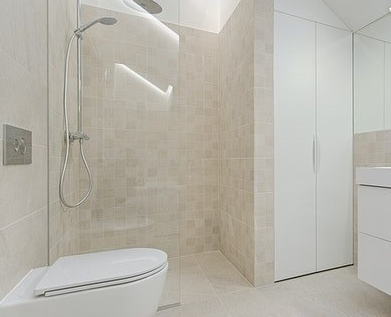 Picture showing a completed bathroom renovation and bathroom tiling completed  Hackney Bathroom Fitters.