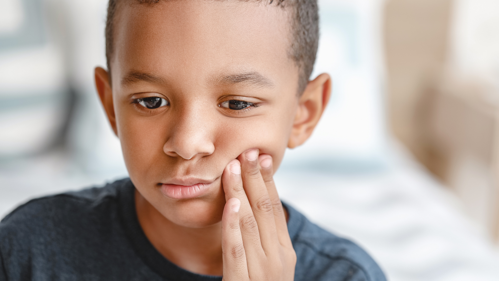 kid with toothache