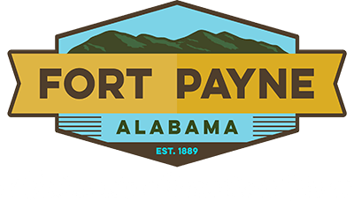 A logo for fort payne alabama with a mountain in the background.