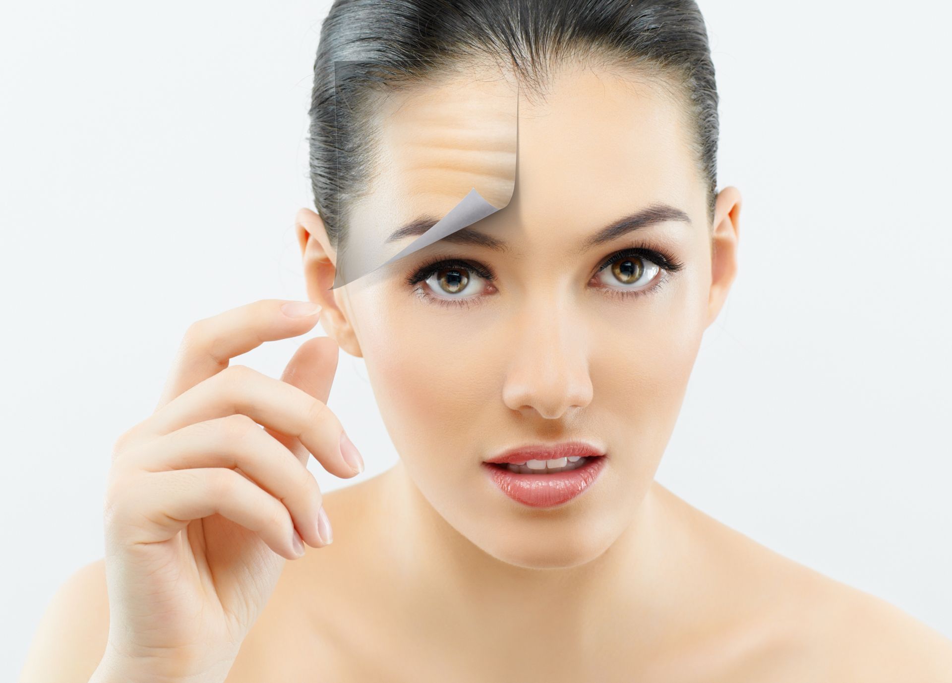 Woman's face with smooth skin on one side and wrinkled skin