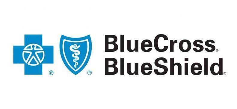 A blue cross blue shield logo with a blue cross and a shield.