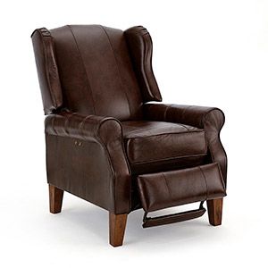 Brown leather armchair with footrest on a white background