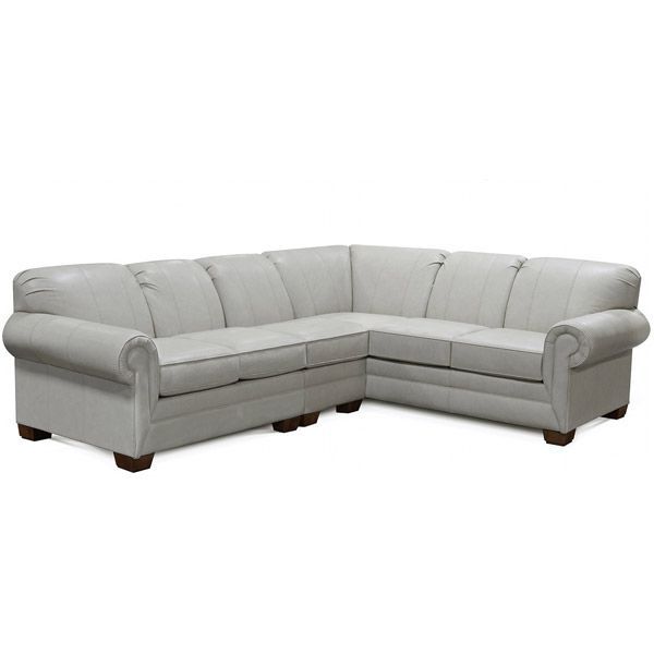 Light gray L-shaped sectional sofa with rolled arms on a white background