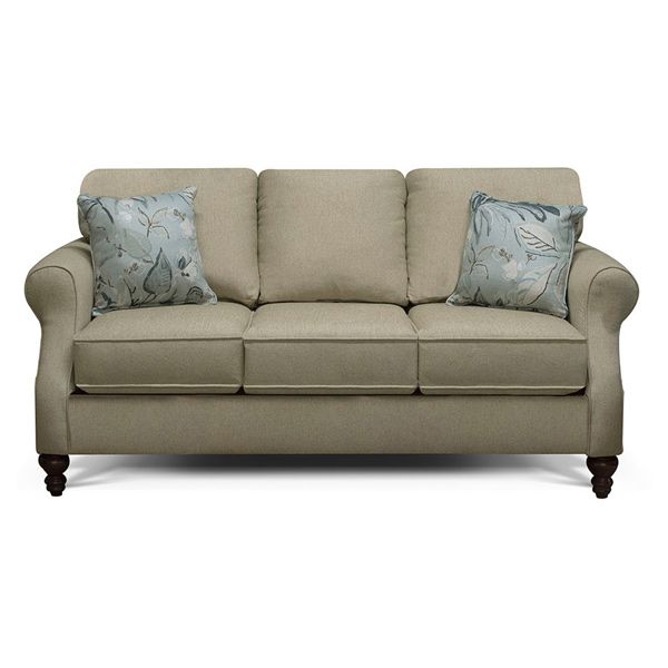 Beige upholstered loveseat with two floral throw pillows and wooden legs