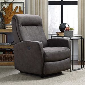 Gray upholstered recliner in a modern living room beside a small table and window
