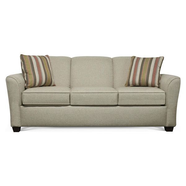 Beige sofa with three seat cushions and striped accent pillows