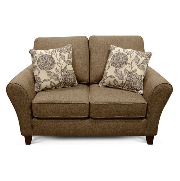 Brown loveseat with two patterned throw pillows on a white background