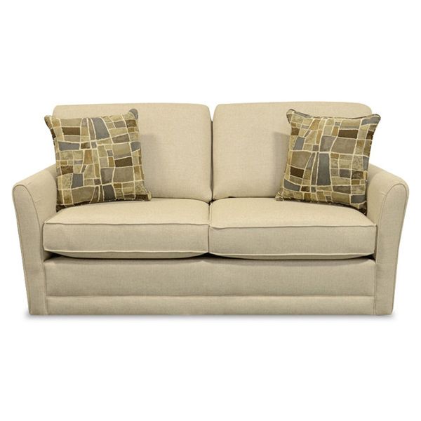 Beige loveseat with two patterned throw pillows on a white background