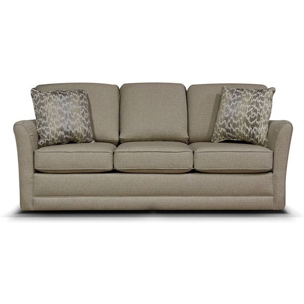 Beige three-seat sofa with patterned throw pillows on a white background