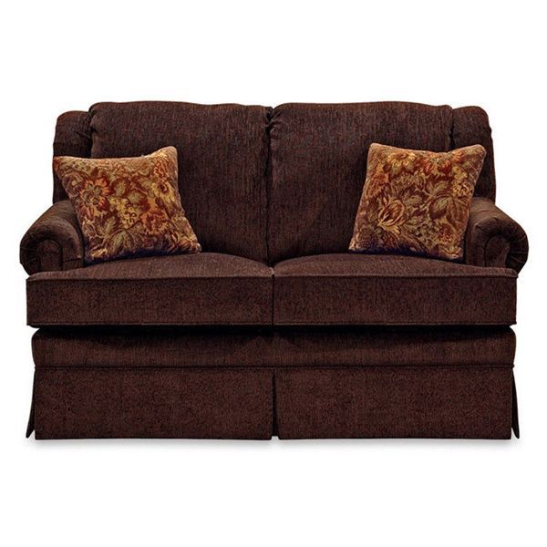 Brown upholstered sofa with two patterned throw pillows