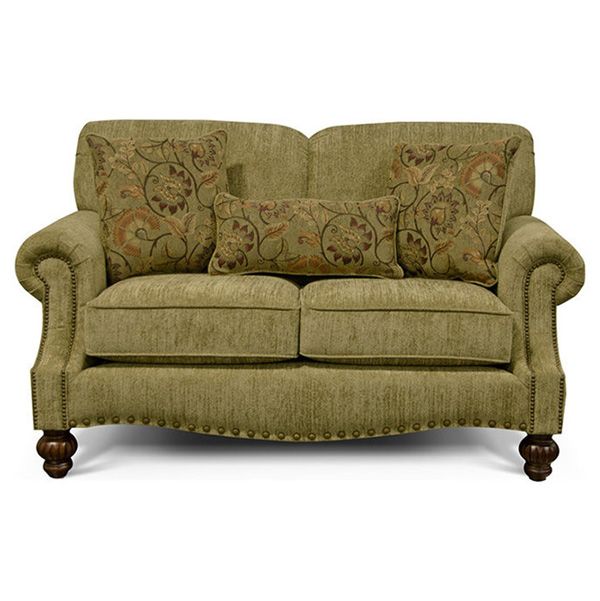 Olive green floral loveseat with rounded arms and dark wooden feet on a white background