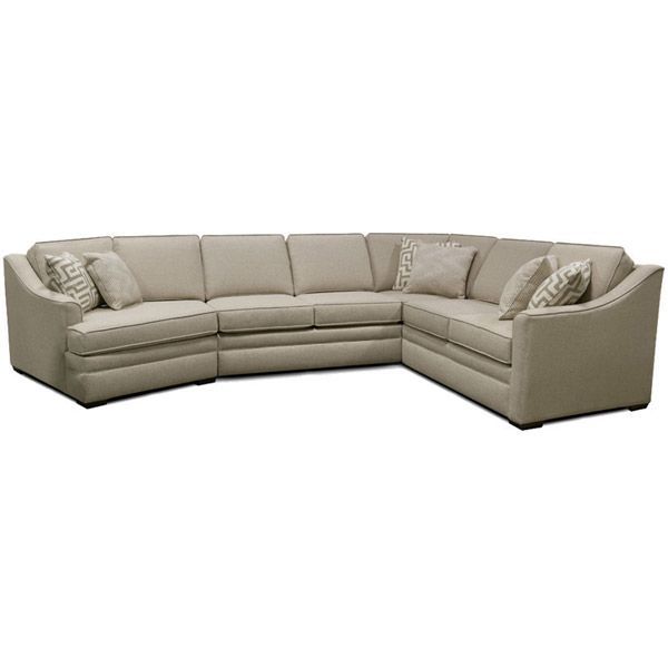 Beige L-shaped sectional sofa with throw pillows on a white background