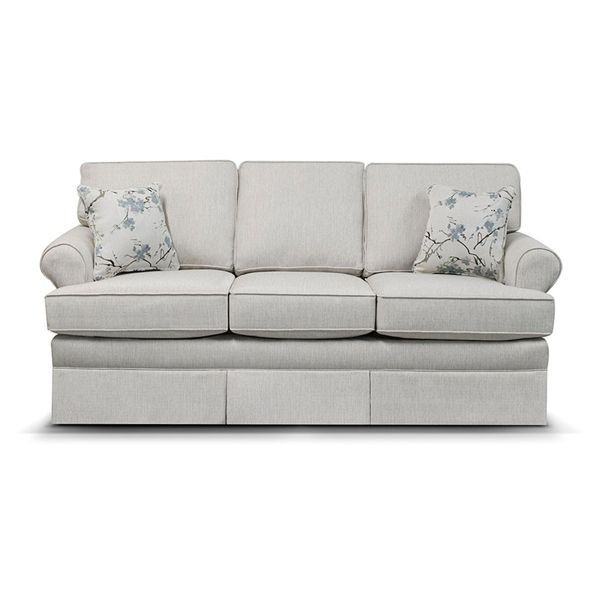Light gray three-seat sofa with floral throw pillows on a white background
