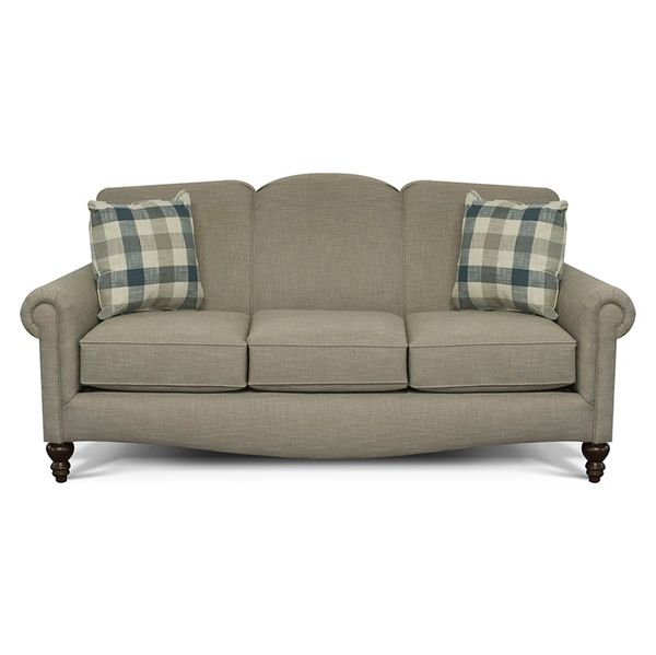 Beige sofa with plaid accent pillows and rolled arms on a white background