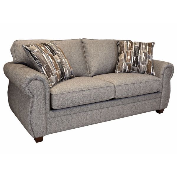 Gray upholstered loveseat with two patterned throw pillows