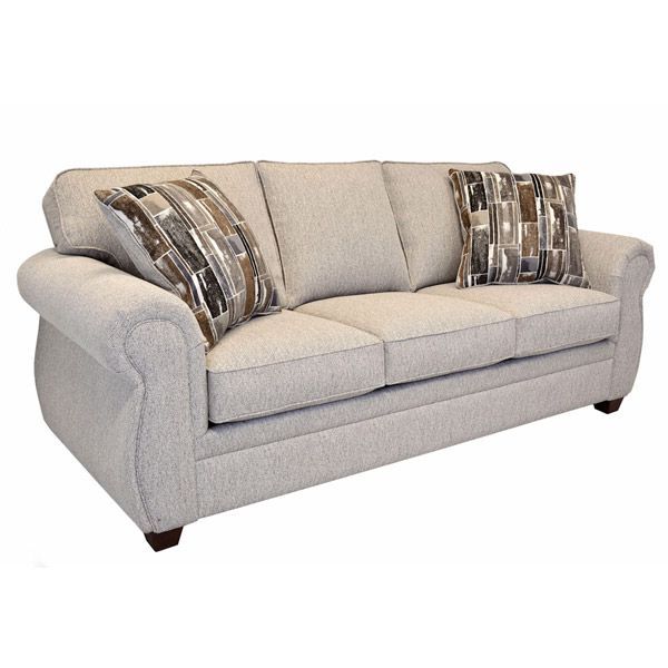 Light gray sofa with patterned throw pillows on a white background