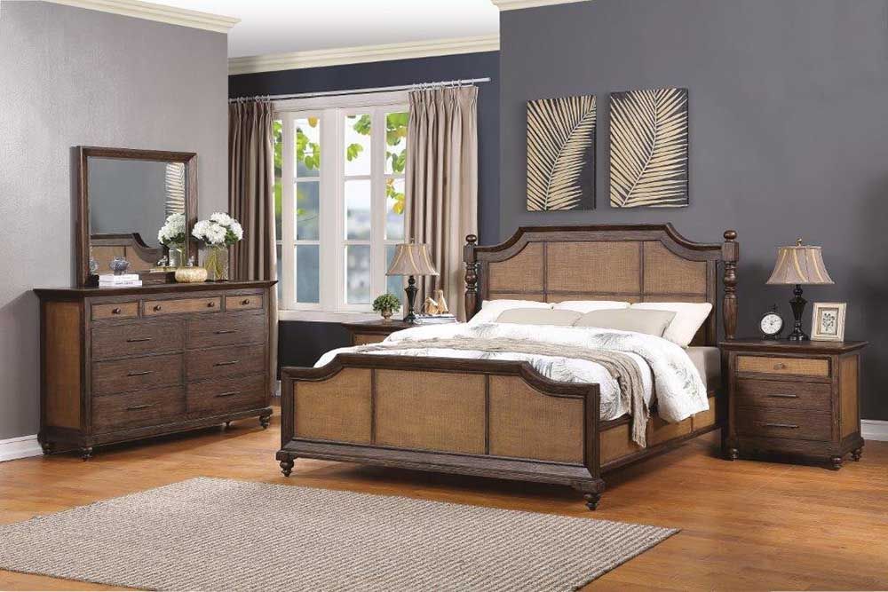Traditional bedroom with dark wood bed, dresser, nightstand, and window with curtains on a gray wall.