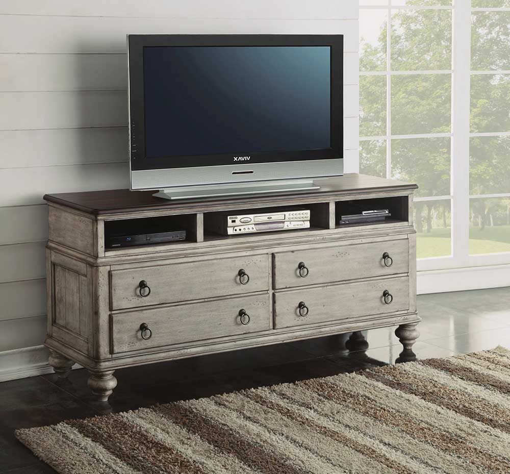 Rustic gray TV stand with a flat-screen TV in a bright room by a window