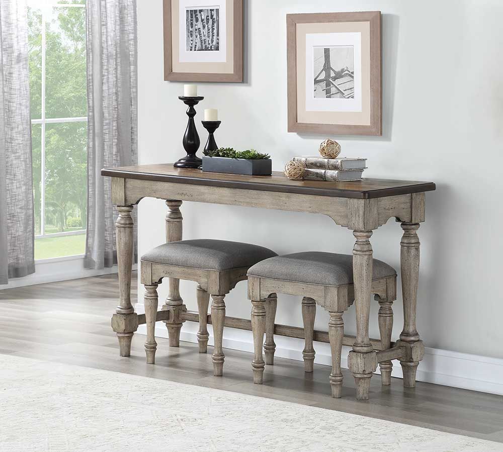 Rustic console table with two upholstered stools in a bright room near a window