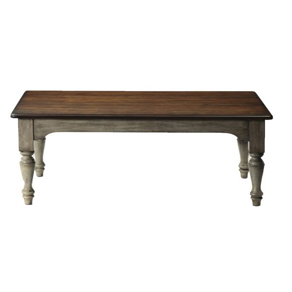 Rustic rectangular wooden dining table with turned legs on a white background