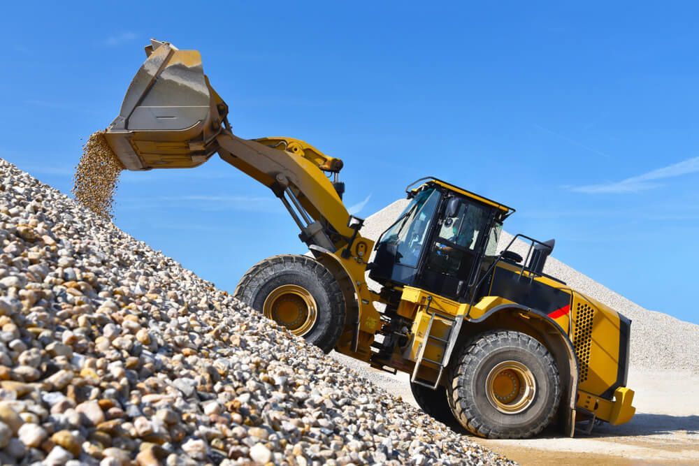 Bulldozer Transporting Gravels — Civil Contractors in Gloucester, NSW