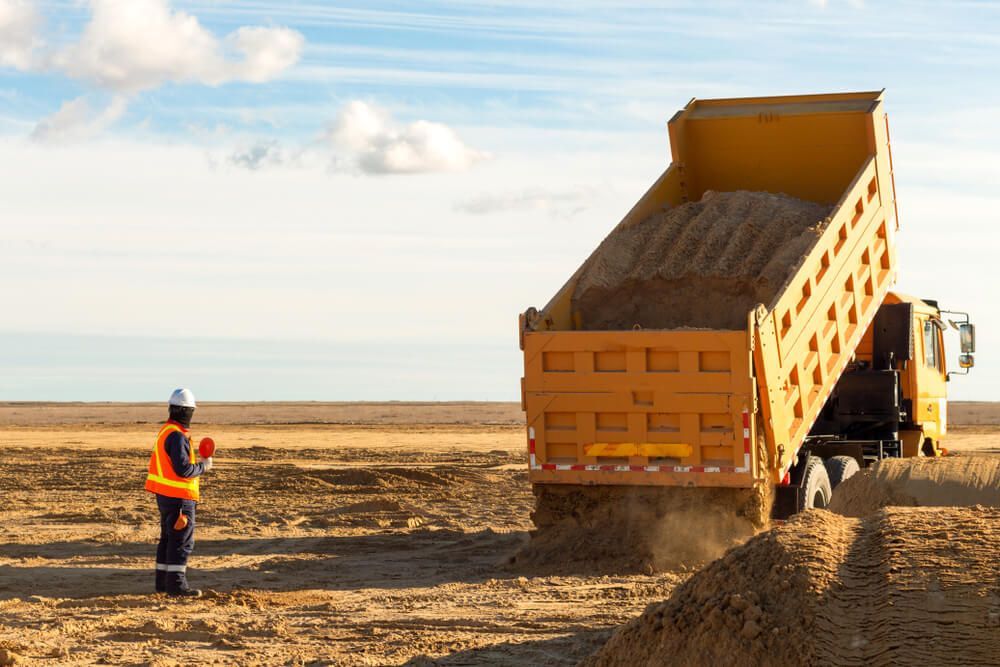Dump Truck Dumping Sand on Site — Civil Contractors in Laurieton, NSW