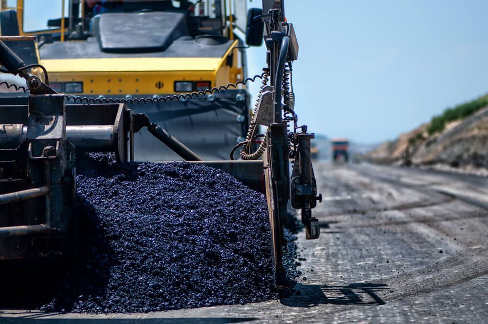 Machine Laying Fresh Asphalt — Civil Contractors in Taree, NSW
