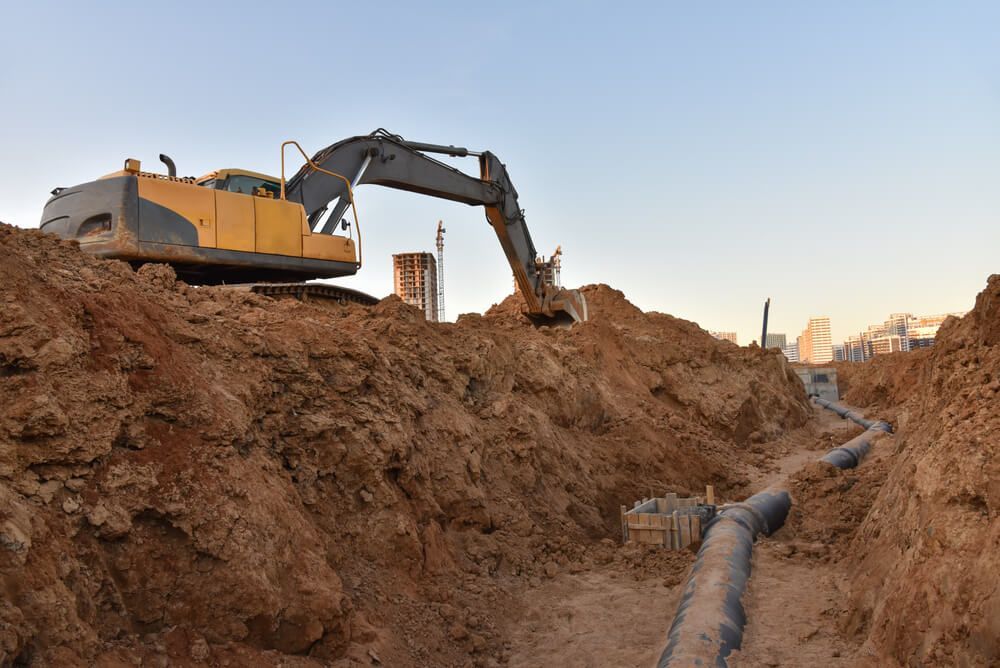 Excavator Digging Trenches at Construction Site — Civil Contractors in Taree, NSW