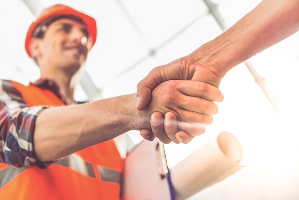 Construction Workers Shaking Hands — Civil Contractors in Coopernook, NSW