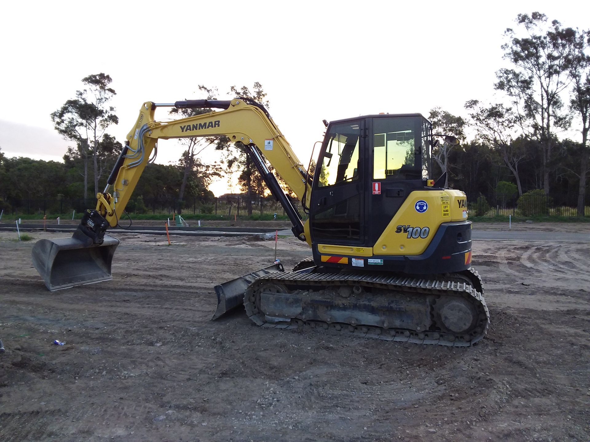 Skid Loader Unloading Bucket — Civil Contractors in Coopernook, NSW