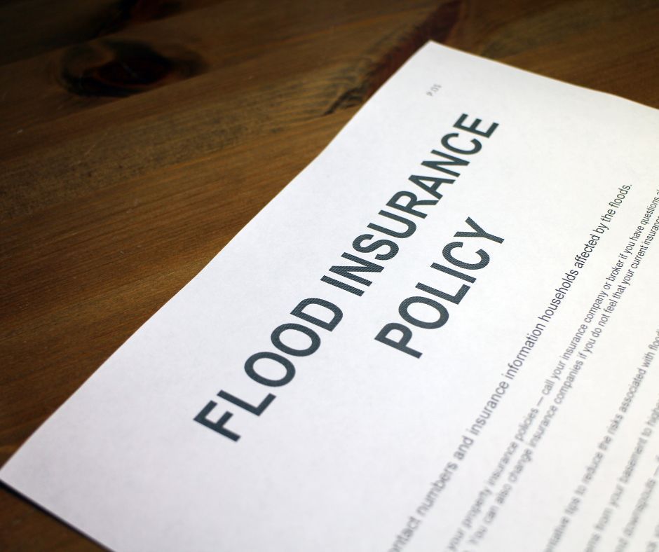 Commercial Flood Restoration paper with flood insurance policy written on it