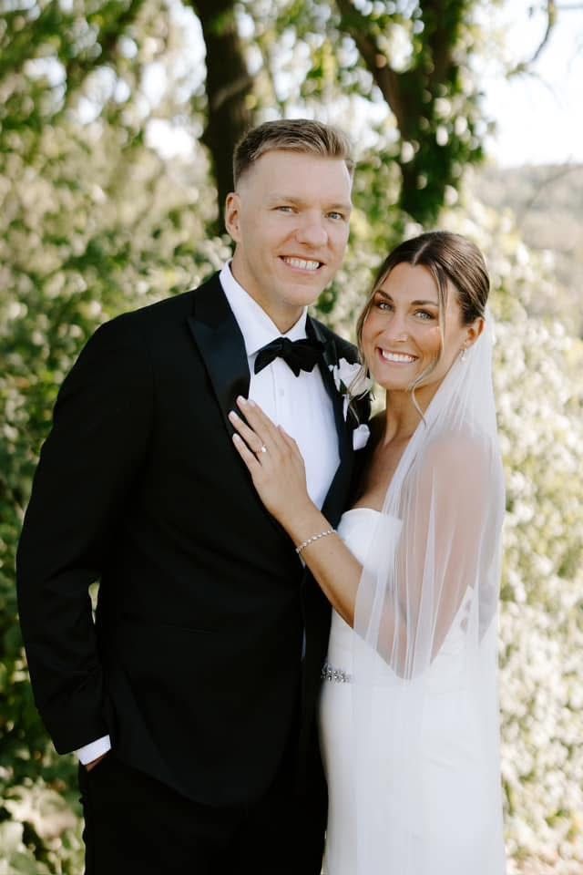Photo of smiling happy couple on their wedding day