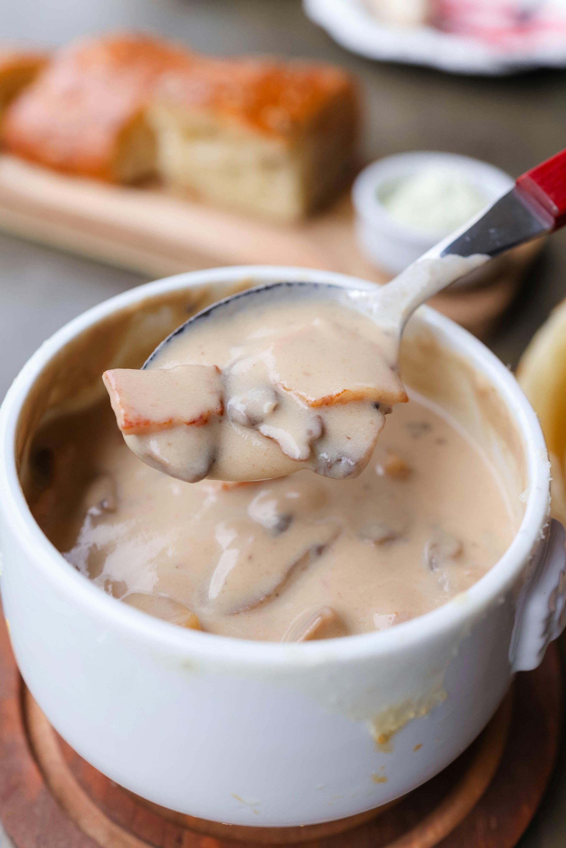 A bowl of soup with a spoon in it