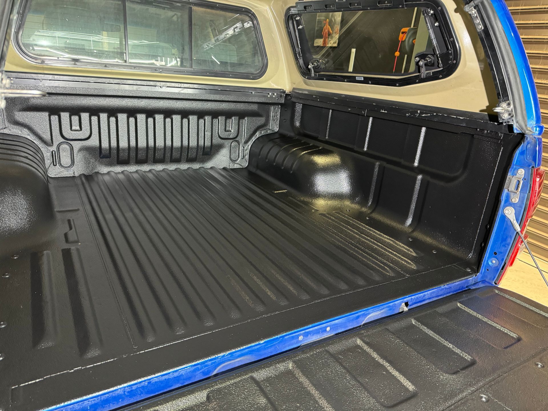 The back of a blue truck with a canopy on top of it — The Works Auto Salon In East Bendigo, VIC