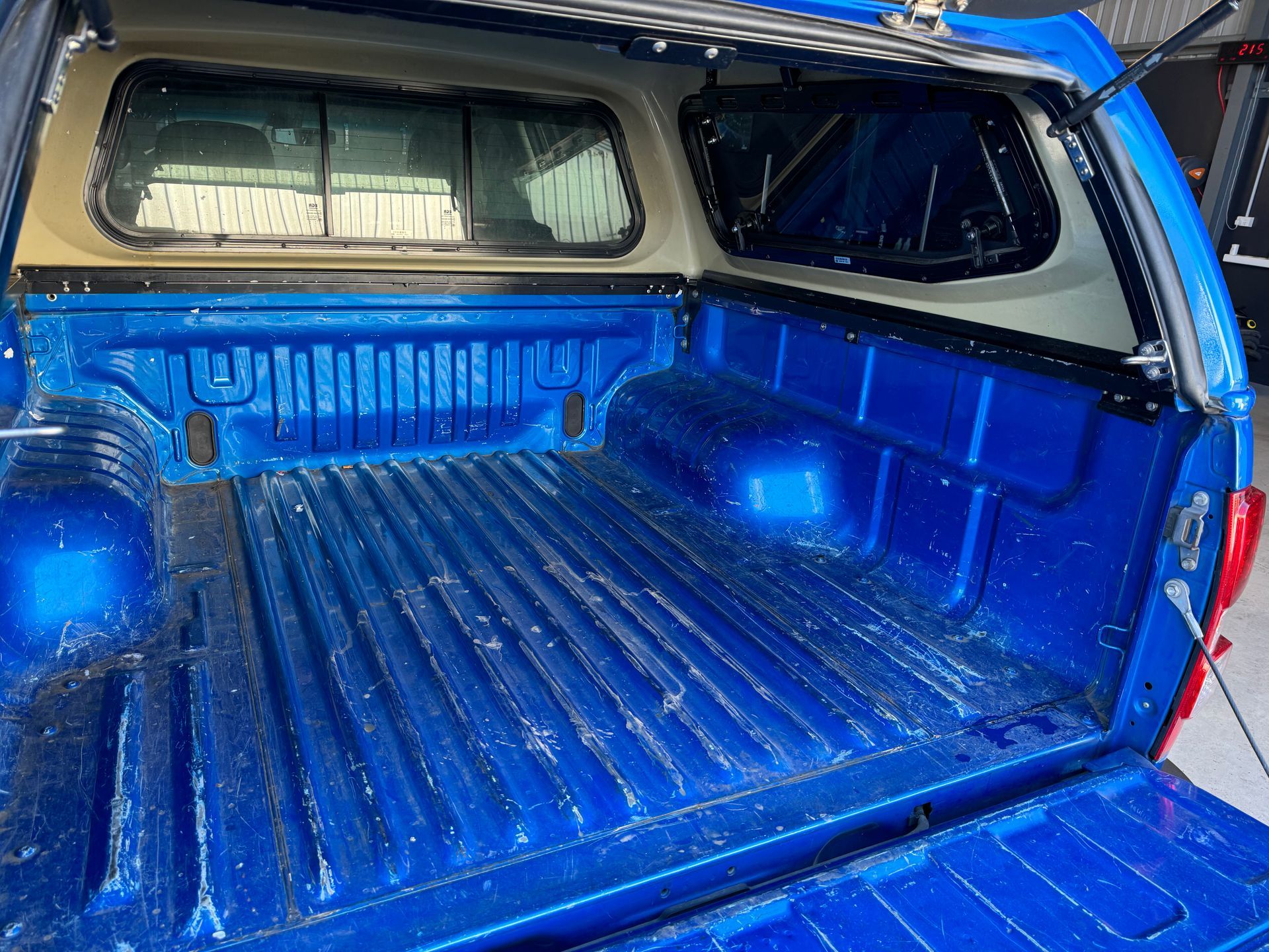 The trunk of a blue truck with a canopy on top of it — The Works Auto Salon In East Bendigo, VIC