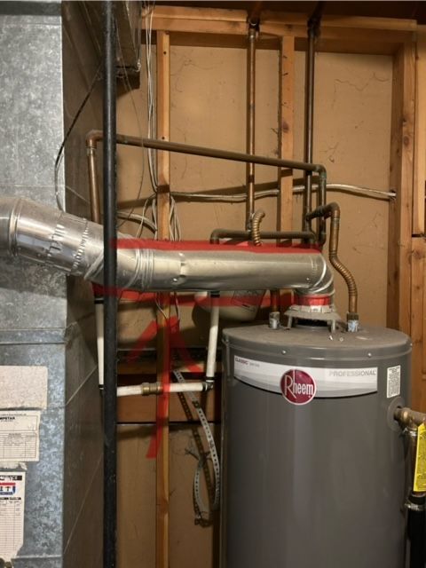 A rheem water heater is installed in a basement