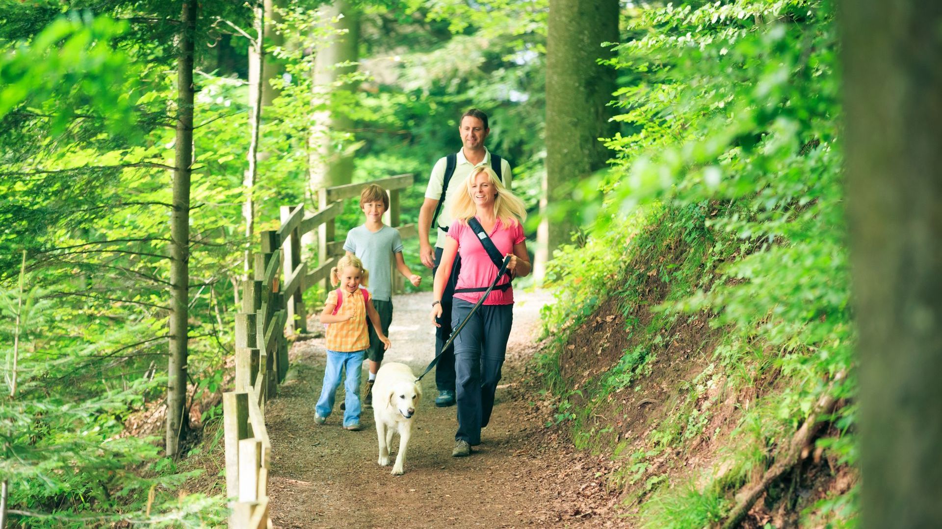 Family walking with pet