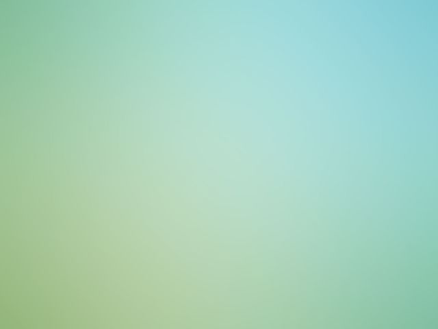 Abstract teal circular logo with concentric rings on a pale green background